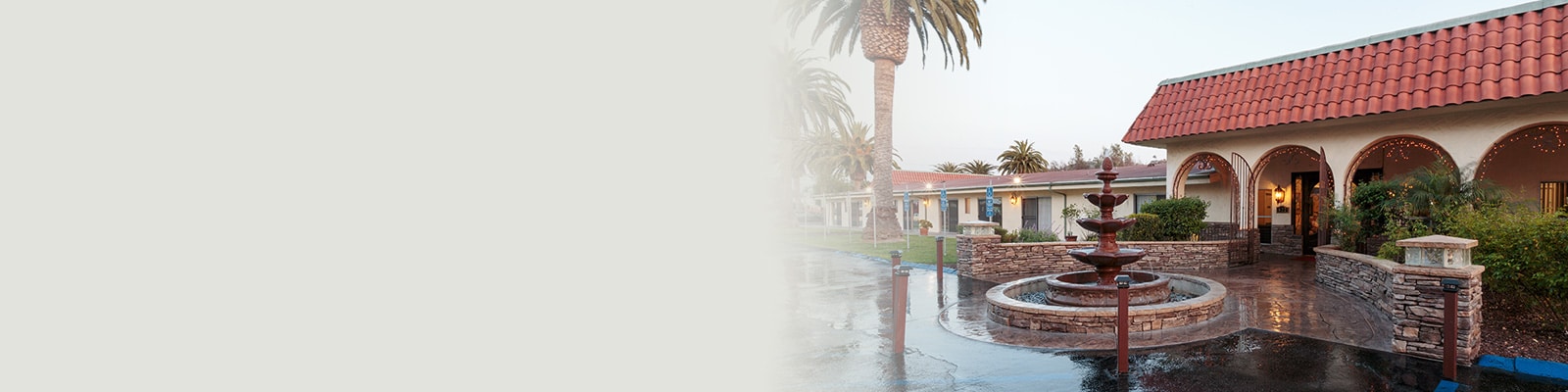 A fountain in the front of Villa Las Palmas
