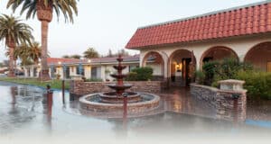 A fountain in the front of Villa Las Palmas